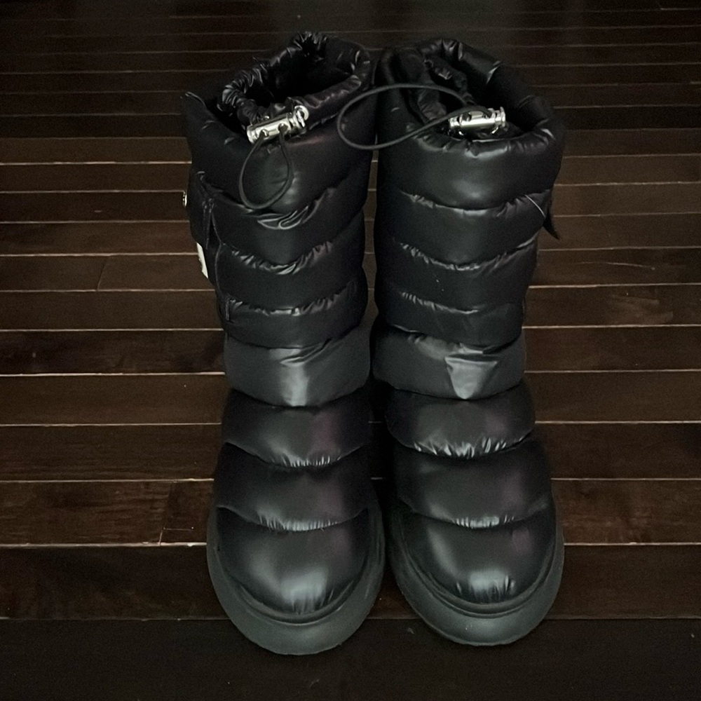 Black Moncler boots.